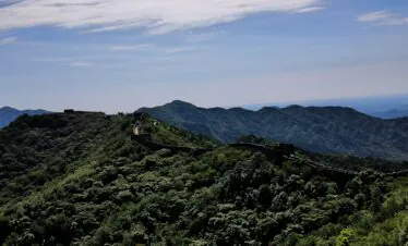 great wall, beijing, china, china tour, Section of the Great Wall winding over green mountain ridges under a blue sky