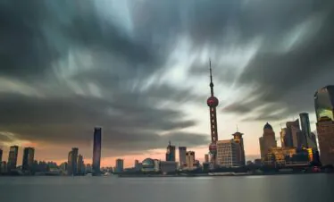 shanghai, china, china tour, Evening cityscape of Shanghai with the Oriental Pearl Tower and modern skyscrapers along the river