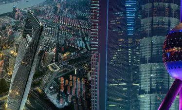 shanghai, china, china tour, Night aerial view of a dense city at night with a river and glowing skyscrapers along the waterway.