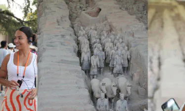 Terra Cotta Warriors, xi'an, china, china tour, Two tour guides with headsets talk to visitors outdoors, with a crowd in the background.