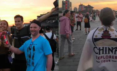great wall, beijing, china, china tour, Group of friends celebrating with drinks at sunset on a historic Chinese plaza in a crowd-filled scene.