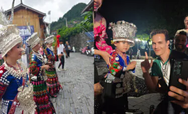 Miao song and dance, guizhou, china, china tour, People in vibrant traditional costumes with ornate silver headdresses at an outdoor festival on a cobblestone street.