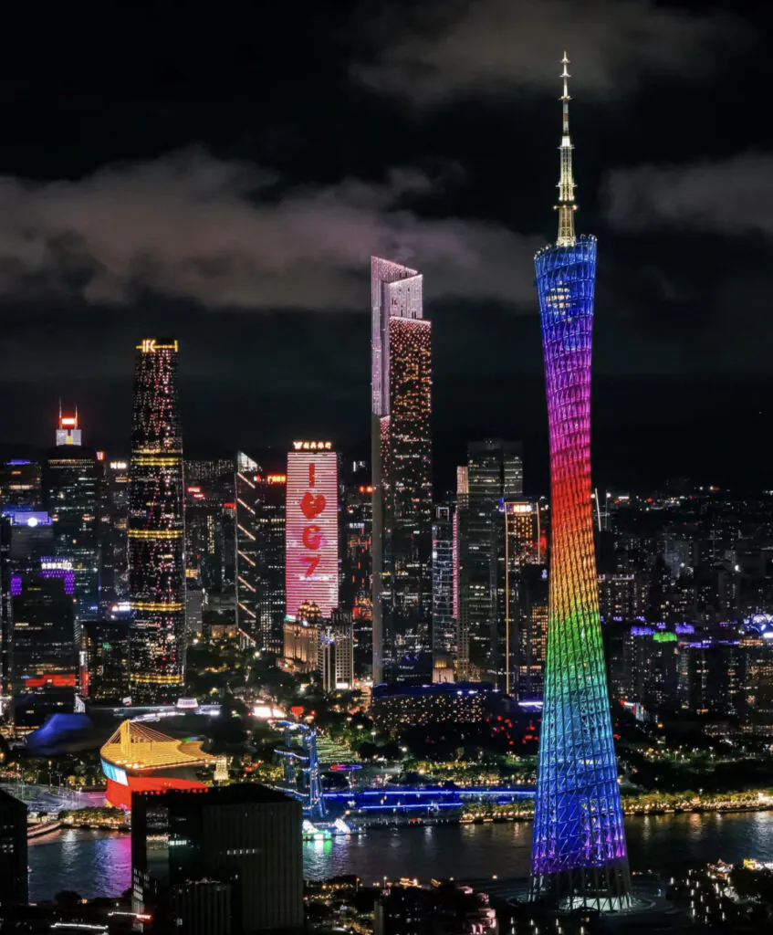 guangzhou, china, chinatrip, Night skyline of Guangzhou with rainbow-lit Canton Tower and illuminated skyscrapers along the river by night time.