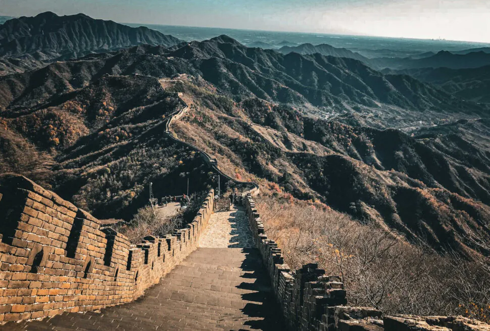 the great wall, beijing, chinatrip, Stone steps and watchtowers of the Great Wall wind over rugged hills toward the horizon.