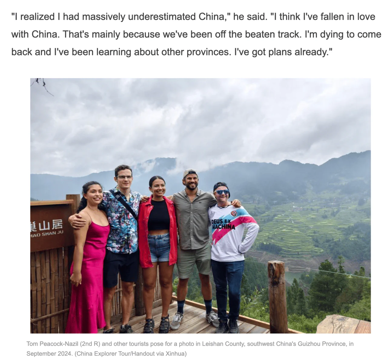 China explorer tour xinhua, chinatrip, Five tourists pose together on a wooden viewing deck overlooking terraced fields and misty mountains in Leishan County, Guizhou, China.