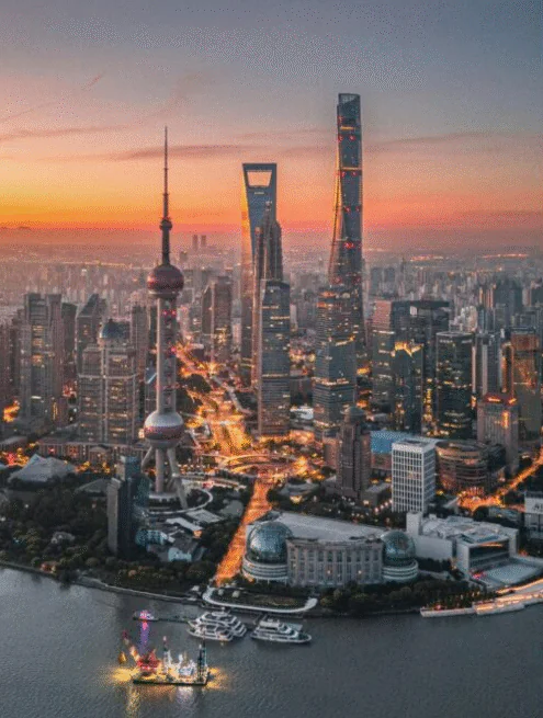 Shanghai,Chinatour Aerial view of Shanghai skyline at sunset with the Oriental Pearl Tower and towering skyscrapers along the Huangpu River.