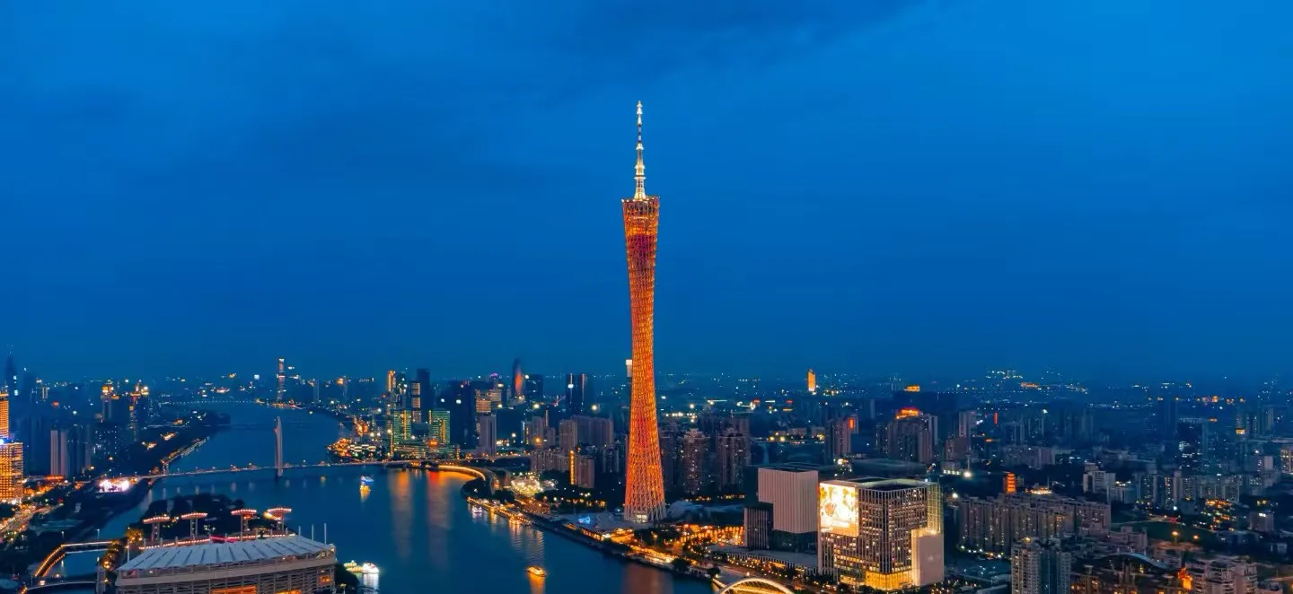 Canton Tower,Guangzhou,Chinatour Guangzhou skyline at dusk with the illuminated Canton Tower along the Pearl River and surrounding buildings reflect in the water