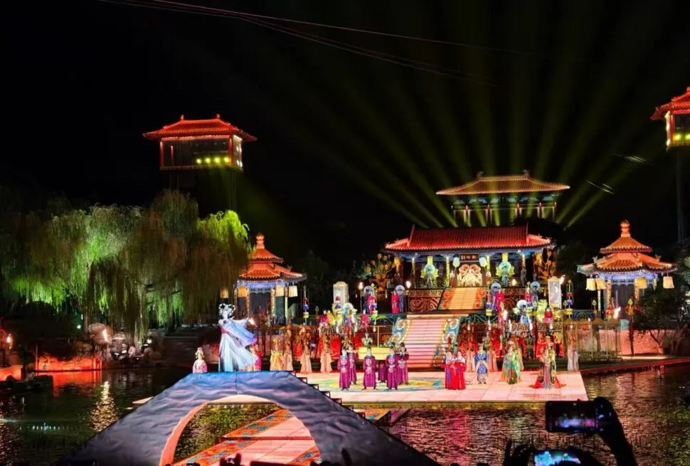 Song of Everlasting Sorrow,Xi`an,Chinatour Night-time outdoor stage with a colorful traditional Chinese performance on a lit, multi-tiered platform over water
