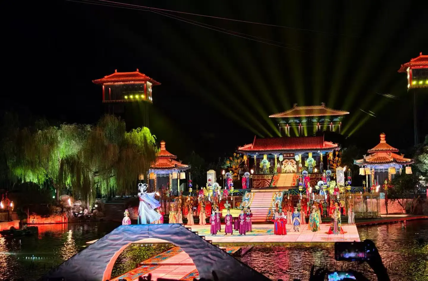 Song of Everlasting Sorrow,Xi`an,Chinatour Night-time outdoor stage with a colorful traditional Chinese performance on a lit, multi-tiered platform over water