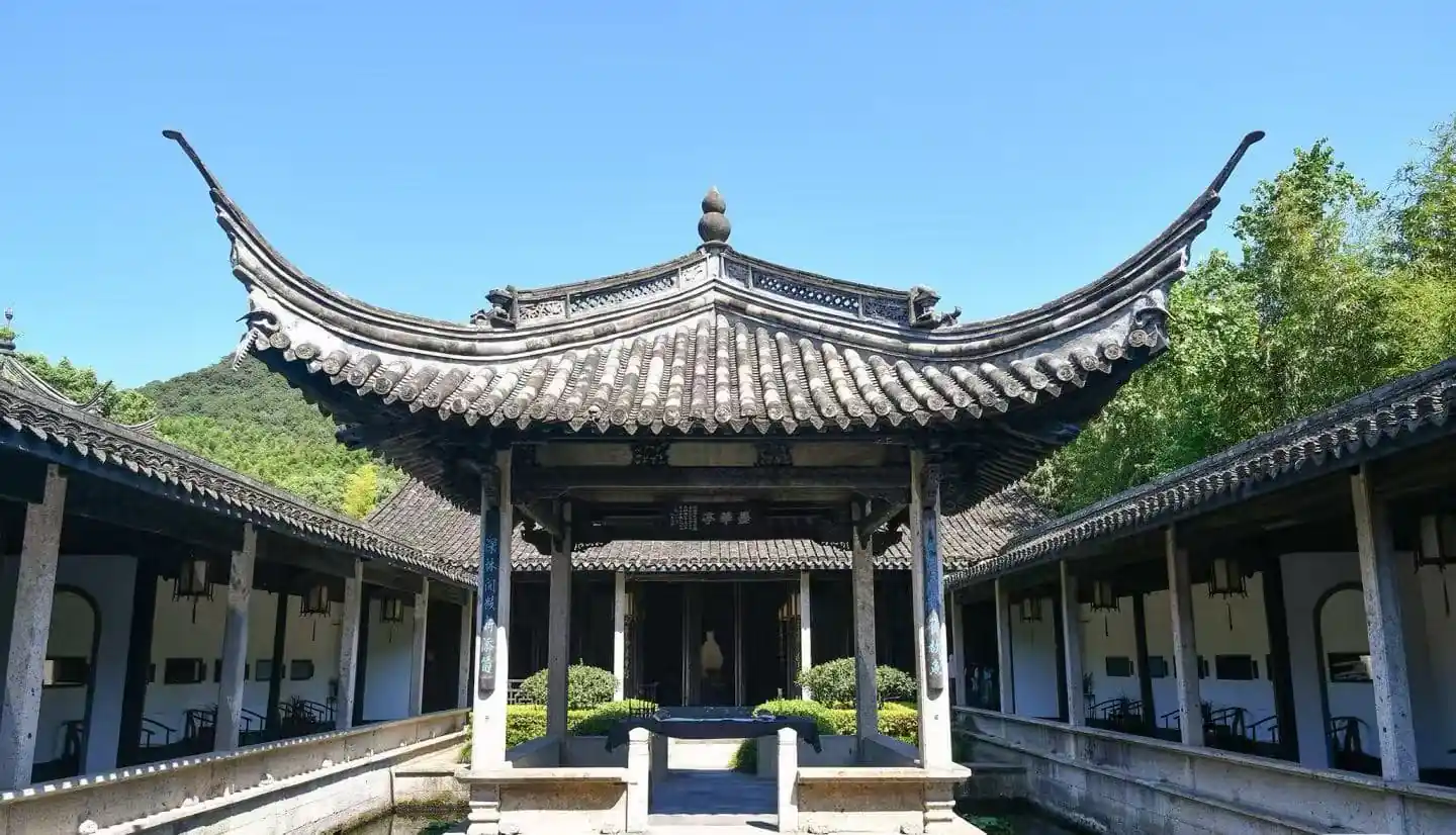 Orchid Pavilion,Shaoxing,Chinatour Traditional Chinese courtyard with a central pavilion and curved tiled roof, surrounded by colonnades.