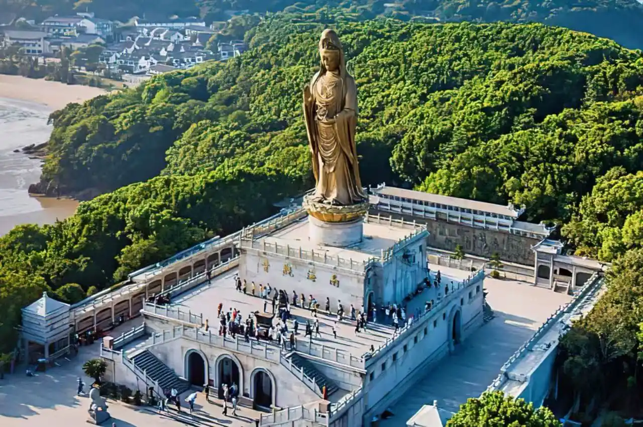 Putuo Mountain,Zhoushan,Chinatour A tall golden statue on a pedestal atop a white temple complex, surrounded by greenery with visitors on the terraces below.