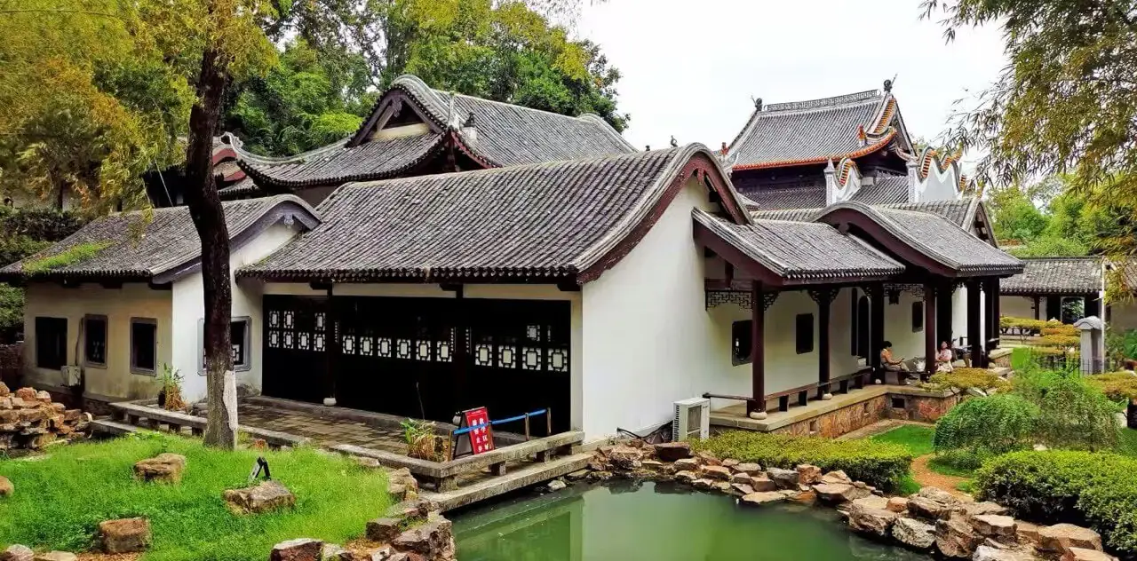 Traditional Chinese courtyard house with curved tile roofs beside a small pond and rock garden.Yuelu Academy,Changsha,Hunan ,Chinatravel