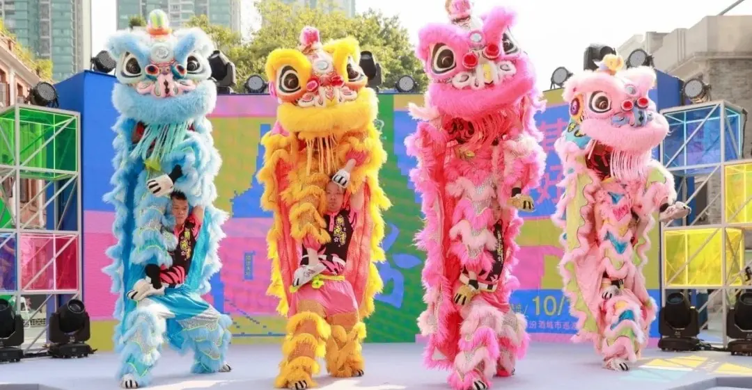 Four colorful lion dance performers on a stage: blue, yellow, pink, and light-pink lions entertaining with dancers inside.𝐆𝐮𝐚𝐧𝐠𝐳𝐡𝐨𝐮 𝐋𝐢𝐨𝐧 𝐃𝐚𝐧𝐜𝐞,𝐂𝐡𝐢𝐧𝐞𝐬𝐞 𝐍𝐞𝐰 𝐘𝐞𝐚𝐫,Guangdong,Chinatravel