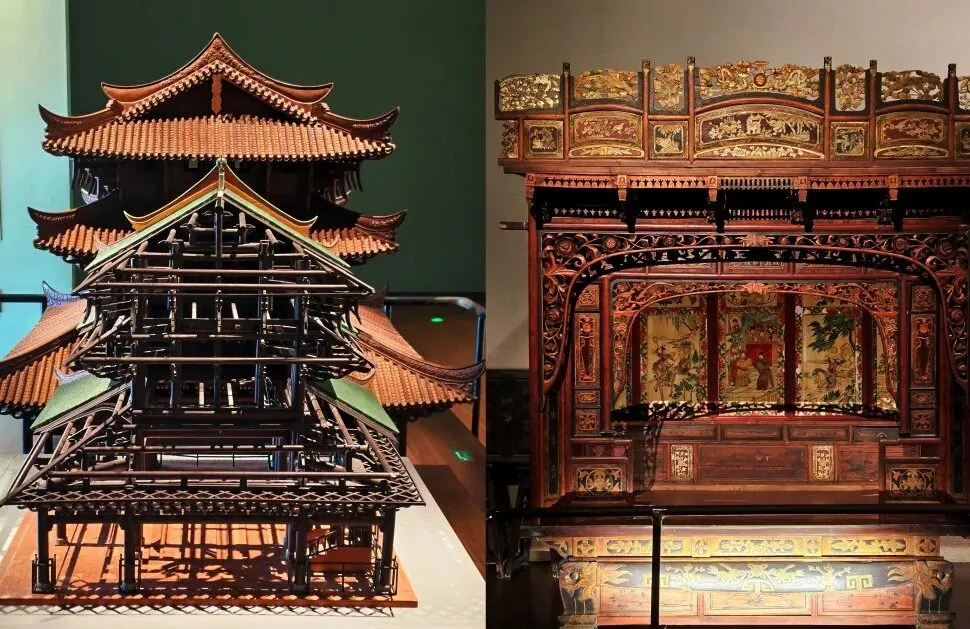 Guangxi Museum,Nanning,Guangxi,Chinaexplorertour Two intricately carved traditional Chinese wooden structures on display: a multi-tiered pagoda-style model on the left and a large ornate cabinet with painted panels on the right in a museum.