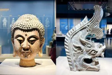 Ningxia Museum,Yinchuan,Ningxia,Chinatravel Two museum sculptures: left a tranquil Buddha head with textured hair; right an ornate dragon head carving with an open mouth and detailed patterns.