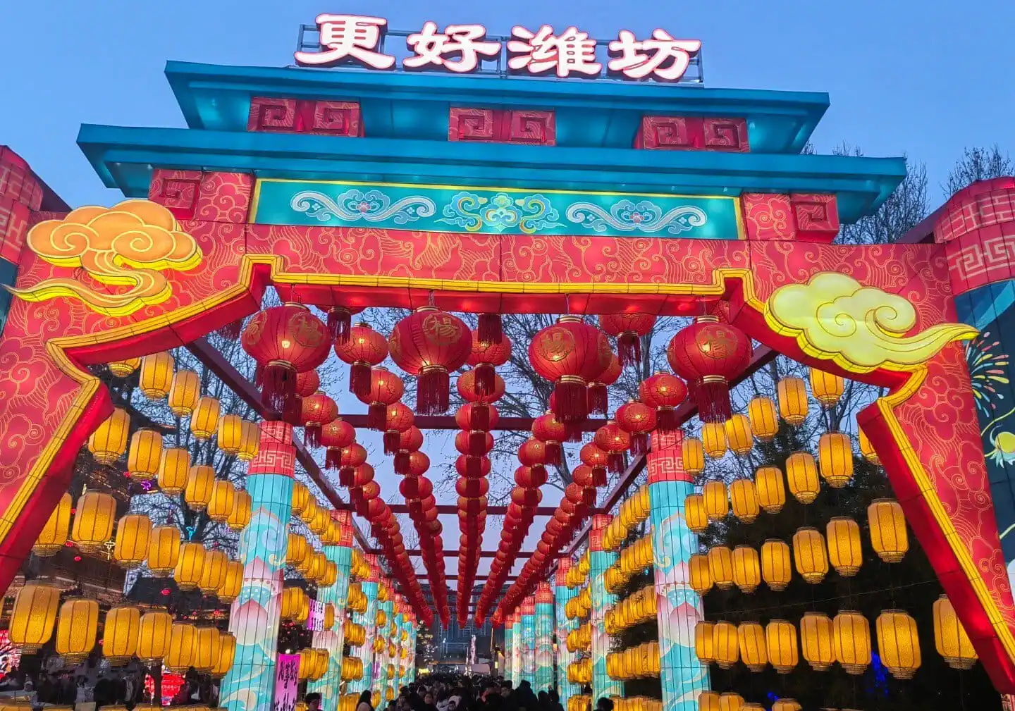 Colorful Chinese lanterns and traditional decorations at a festival entrance in China.