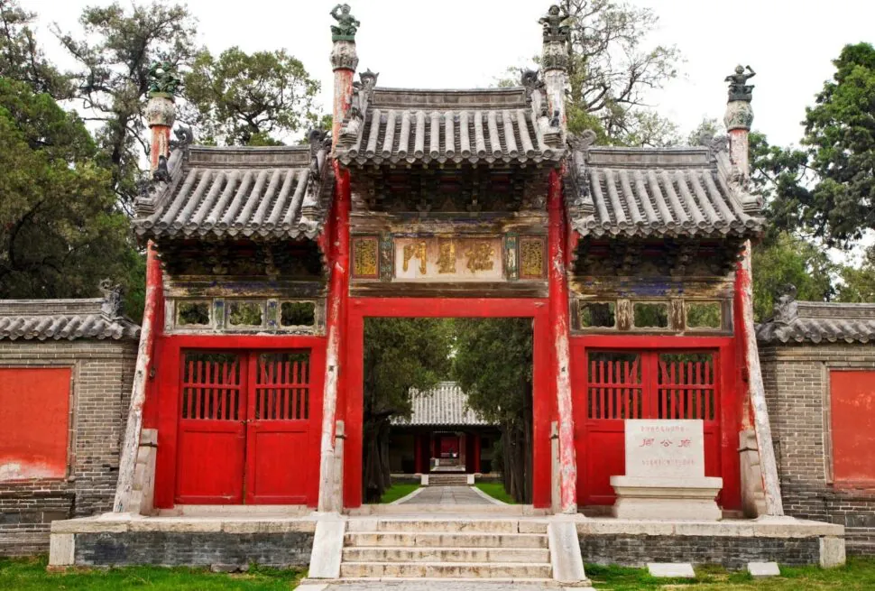 Confucius Mansion,Qufu,Chinatour Traditional Chinese temple gate with red wooden doors and ornate roof details.
