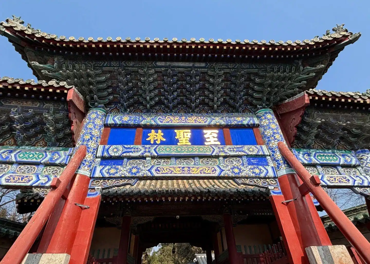 The Forbidden City entrance gate with traditional Chinese architecture and ornate decorations.