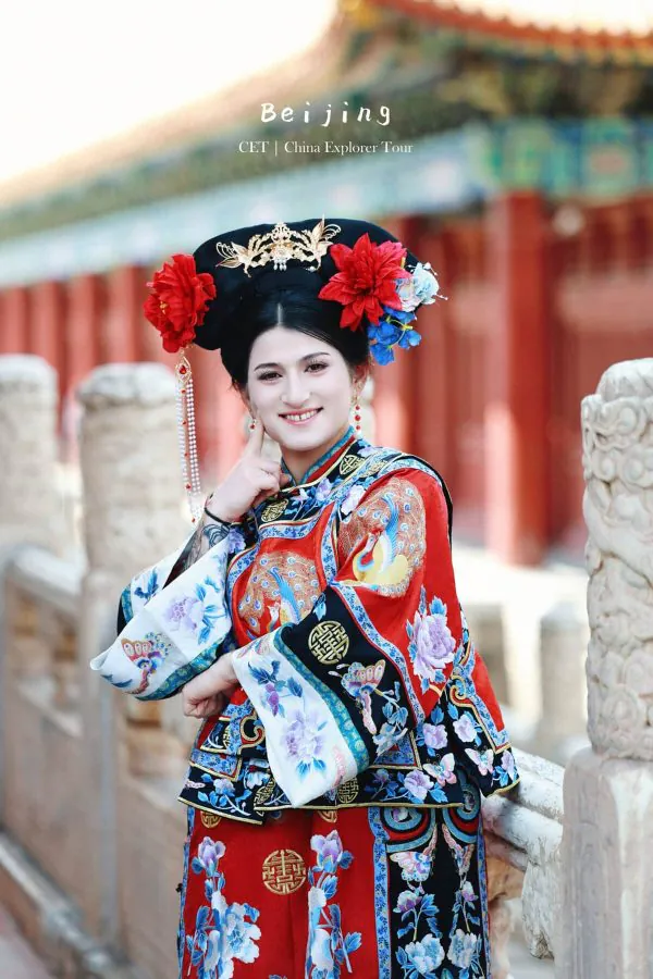 hanfu photoshoot, the forbidden city, beijing, qing dynasty, female, solo, chinatravel, Woman in an ornate traditional Chinese opera costume with a red robe and jeweled headdress, posing outdoors in Beijing.