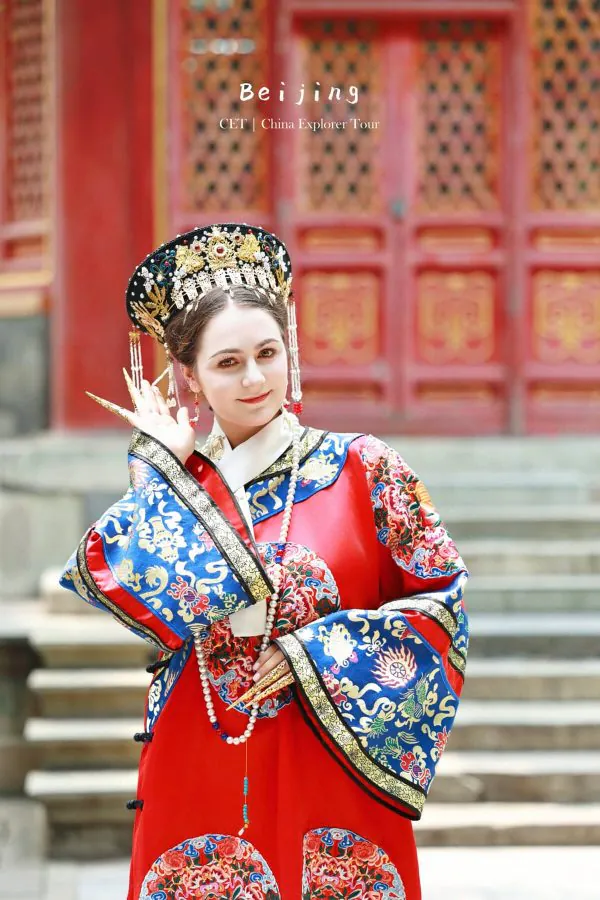 Hanfu photoshoot, zhongshan park, beijing, solo, chinatravel, Young woman in an ornate traditional Chinese opera costume and headdress, posing in front of a decorative temple doorway in Beijing.