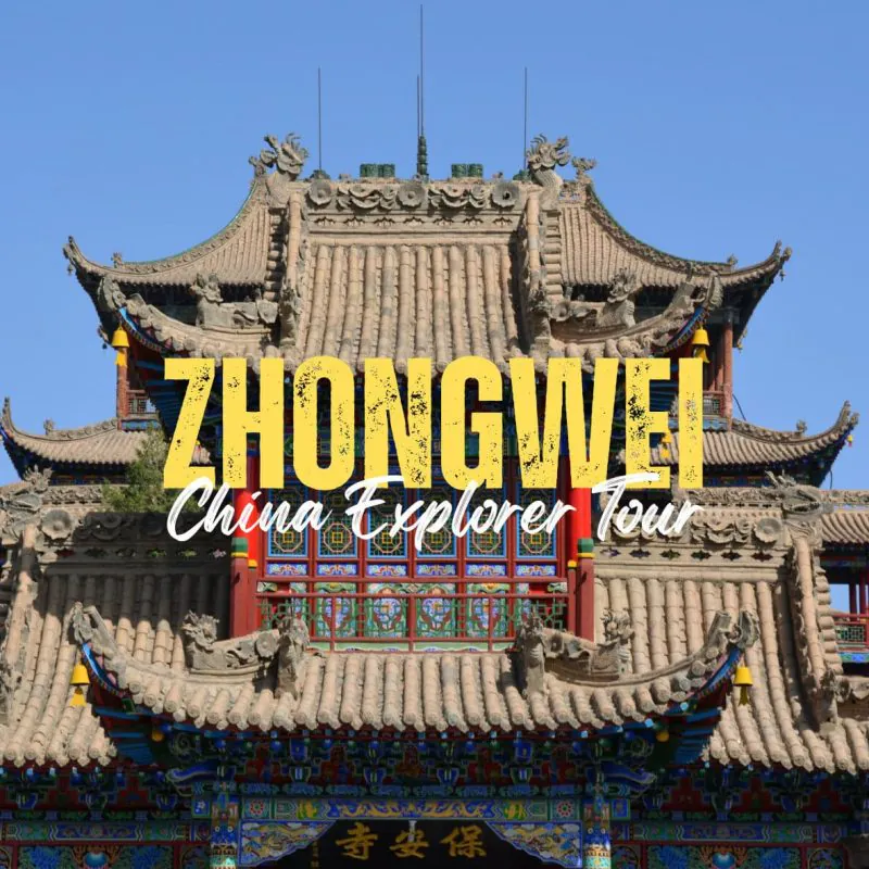 Zhongwei,Ningxia,China tour Promotional banner for Zhongwei China Explorer Tour over a traditional Chinese temple façade.