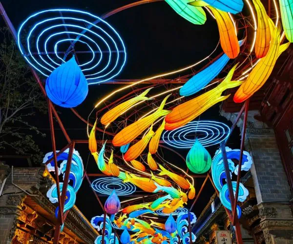 Huangyuan Ancient City,Xining,Chinatrip Night street festival scene with colorful neon lanterns overhead at night.