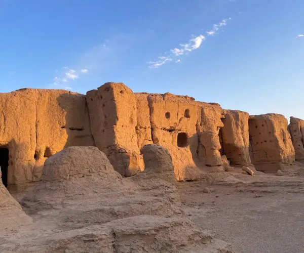 Ancient City of Jiaohe,Turpan,China tour Desert ruins of sun-baked mud bricks with hollow windows and doorways under a clear blue sky