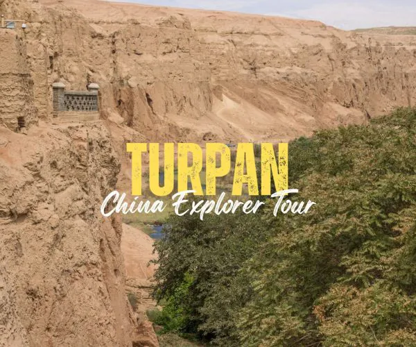 Turpan,Xinjiang,China tour Desert canyon with bold yellow 'TURPAN' and white 'China Explorer Tour' text overlay, promoting a tour.