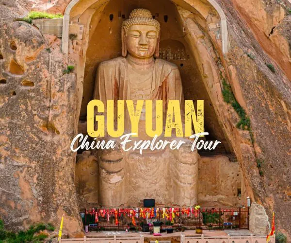 Guyuan,Ningxia,China tour Rock-cut Buddha statue inside a canyon, with yellow tour text overlay reading 'GUYUAN China Explorer Tour'