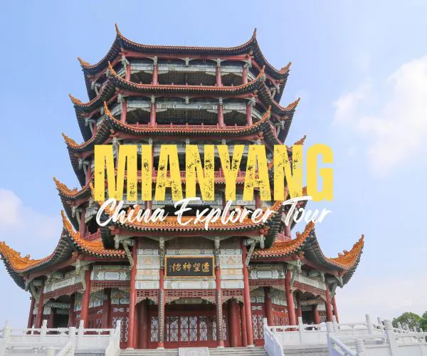 Mianyang,Sichuan,Chinatravel Three-tier Chinese pagoda with red columns and orange roof against a blue sky, with 'DUAN YANG' and 'China Explorer Tour' text overlay.
